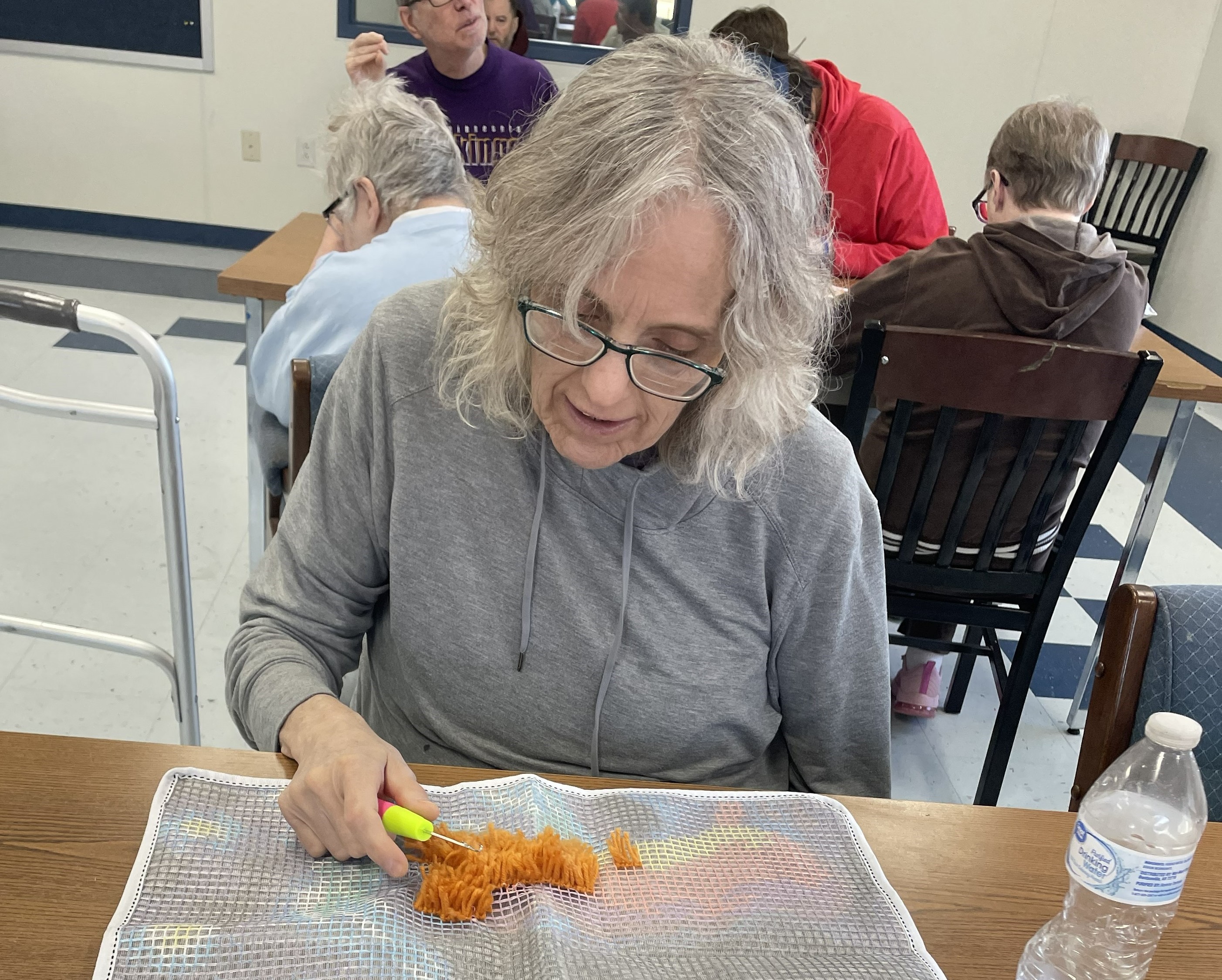 Active Aging participants holding fresh vegetables